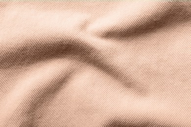 Image of Fabric in mocha mousse shade, closeup. Trendy color of 2025 year