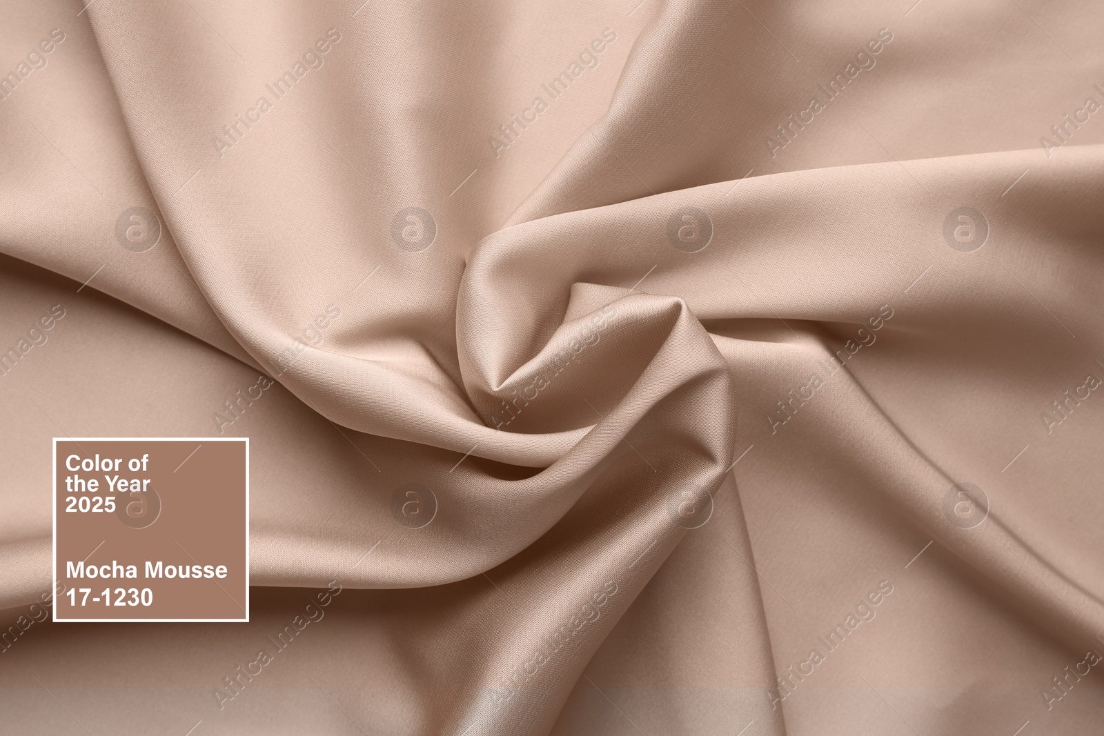 Image of Mocha mousse - color of 2025 year. Silk fabric in brown shade, closeup