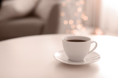 Image of Coffee on table indoors, toned in mocha mousse shade. Trendy color of 2025 year