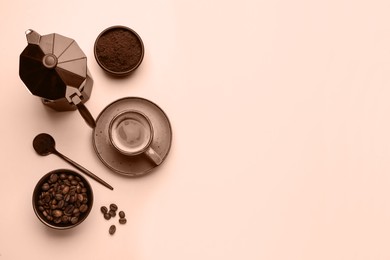 Image of Flat lay composition with coffee in cup and roasted beans, toned in mocha mousse shade. Trendy color of 2025 year