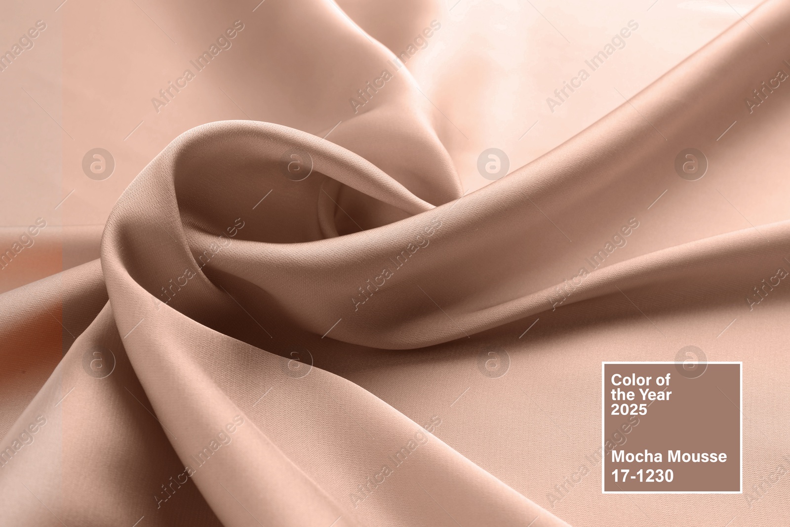 Image of Mocha mousse - color of 2025 year. Silk fabric in brown shade, closeup