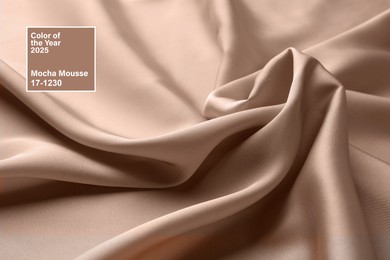 Image of Mocha mousse - color of 2025 year. Silk fabric in brown shade, closeup