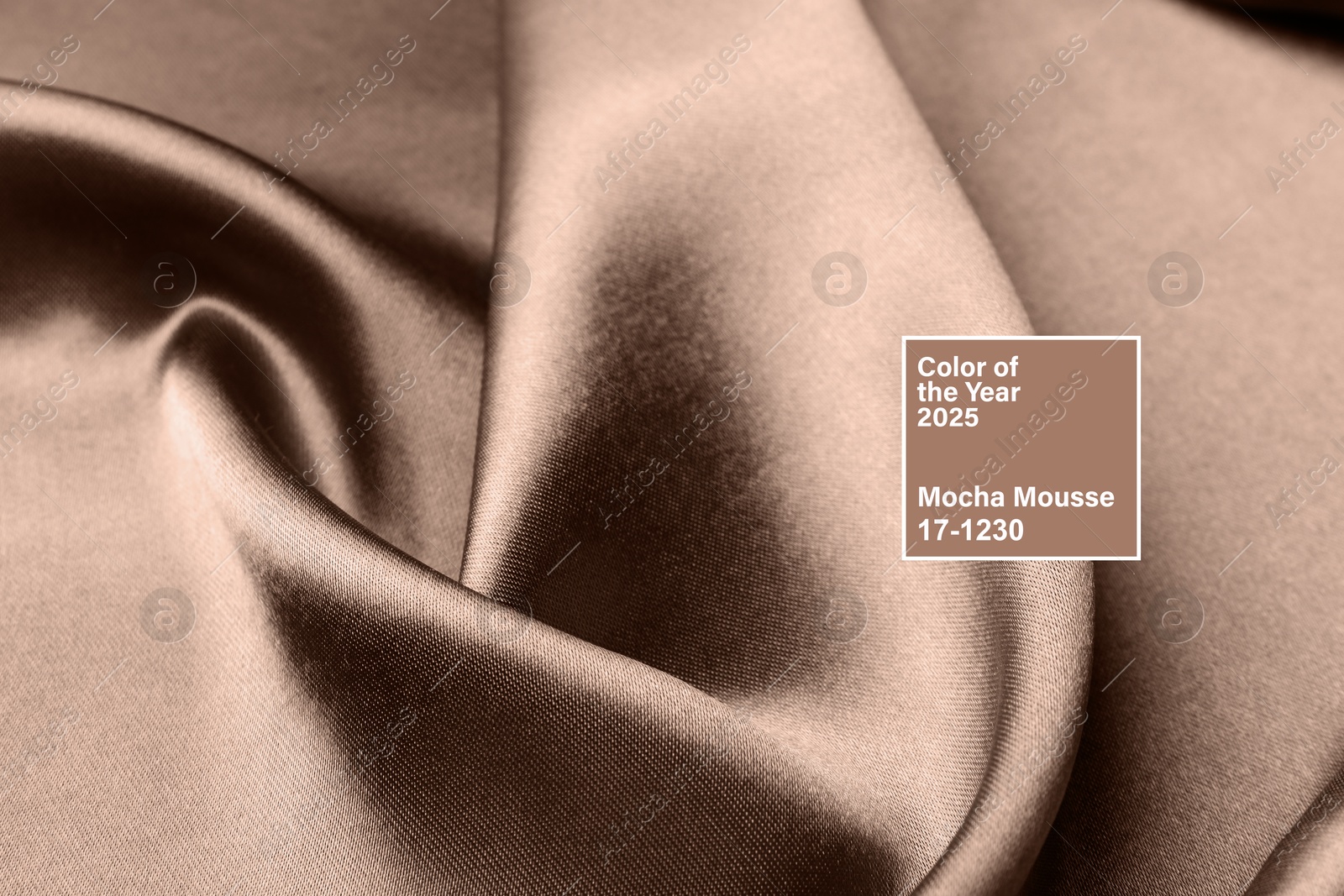 Image of Mocha mousse - color of 2025 year. Silk fabric in brown shade, closeup