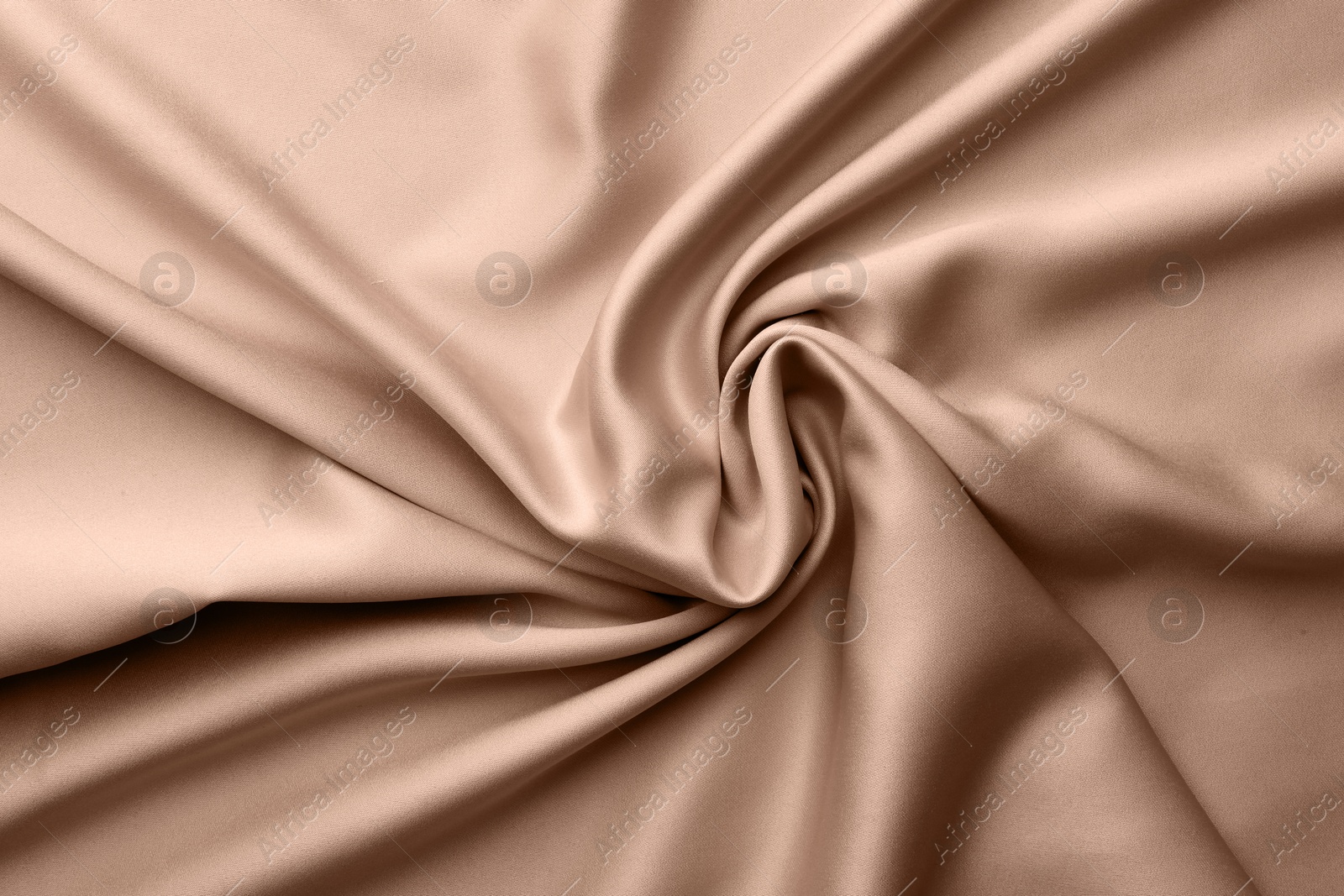 Image of Silk fabric in mocha mousse shade, closeup. Trendy color of 2025 year