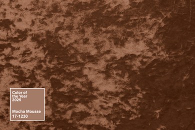 Image of Mocha mousse - color of 2025 year. Velvet fabric in brown shade, closeup