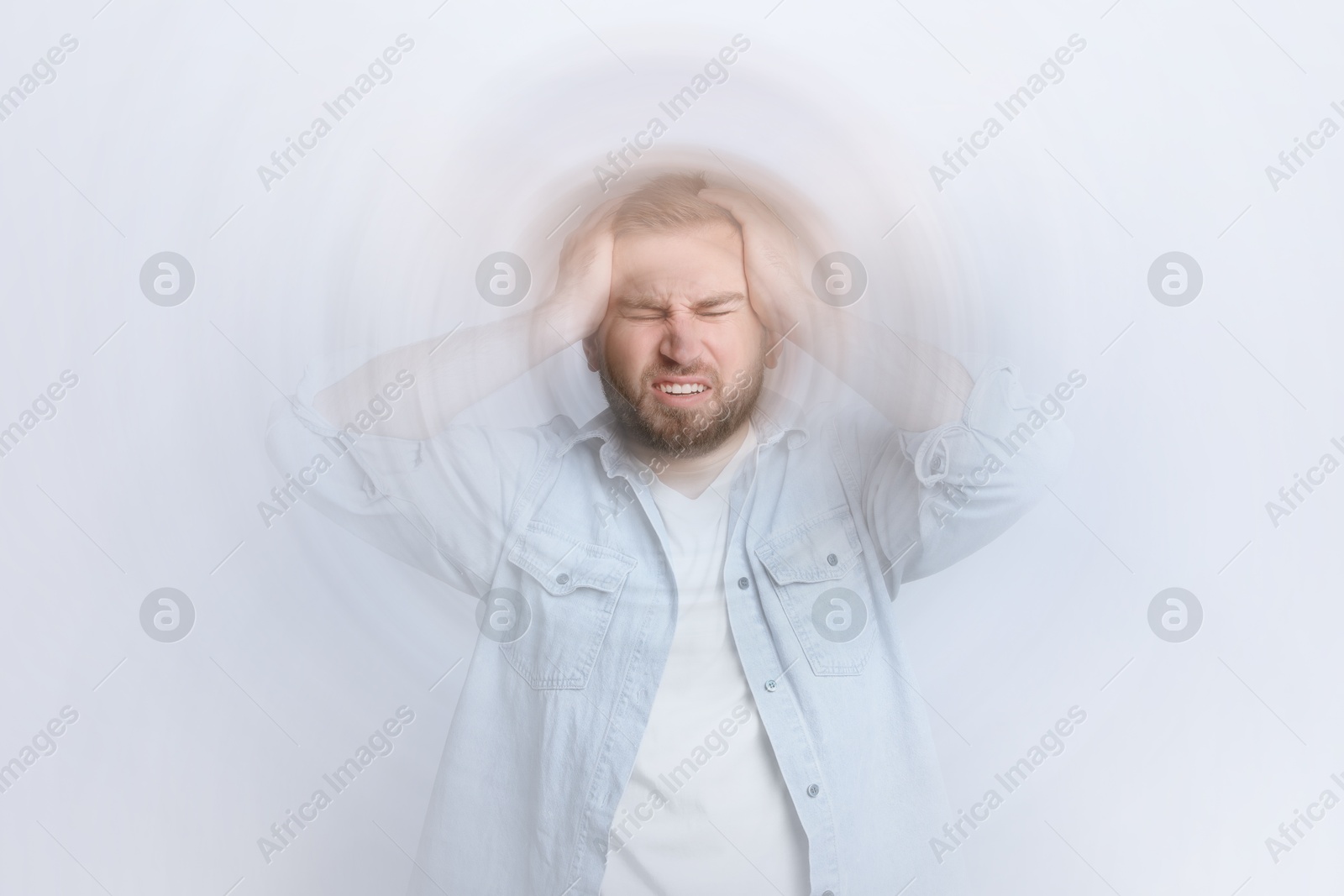 Image of Man suffering from headache and dizziness on white background