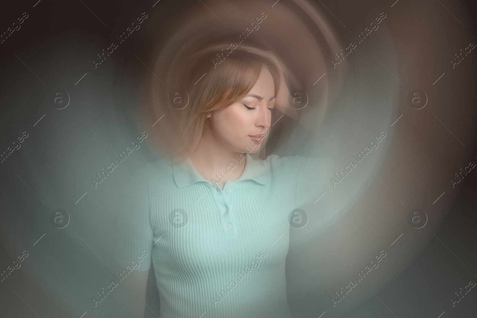 Image of Woman suffering from headache and dizziness on dark brown background