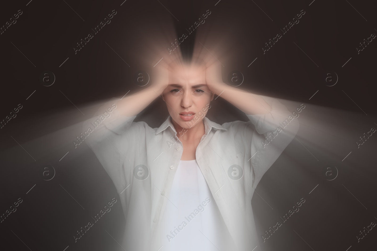 Image of Woman suffering from headache and dizziness on dark brown background