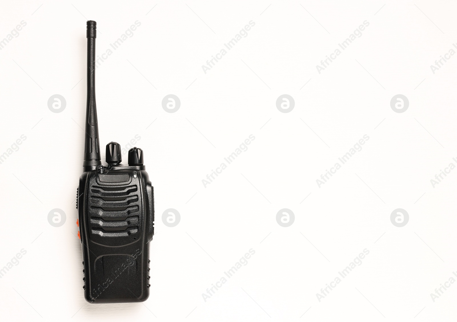 Photo of One walkie talkie on white background, top view. Space for text