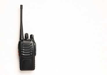 Photo of One walkie talkie on white background, top view. Space for text