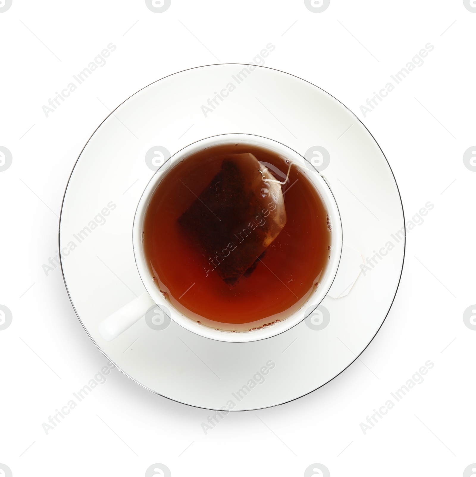 Photo of Tea bag in cup with hot drink isolated on white, top view