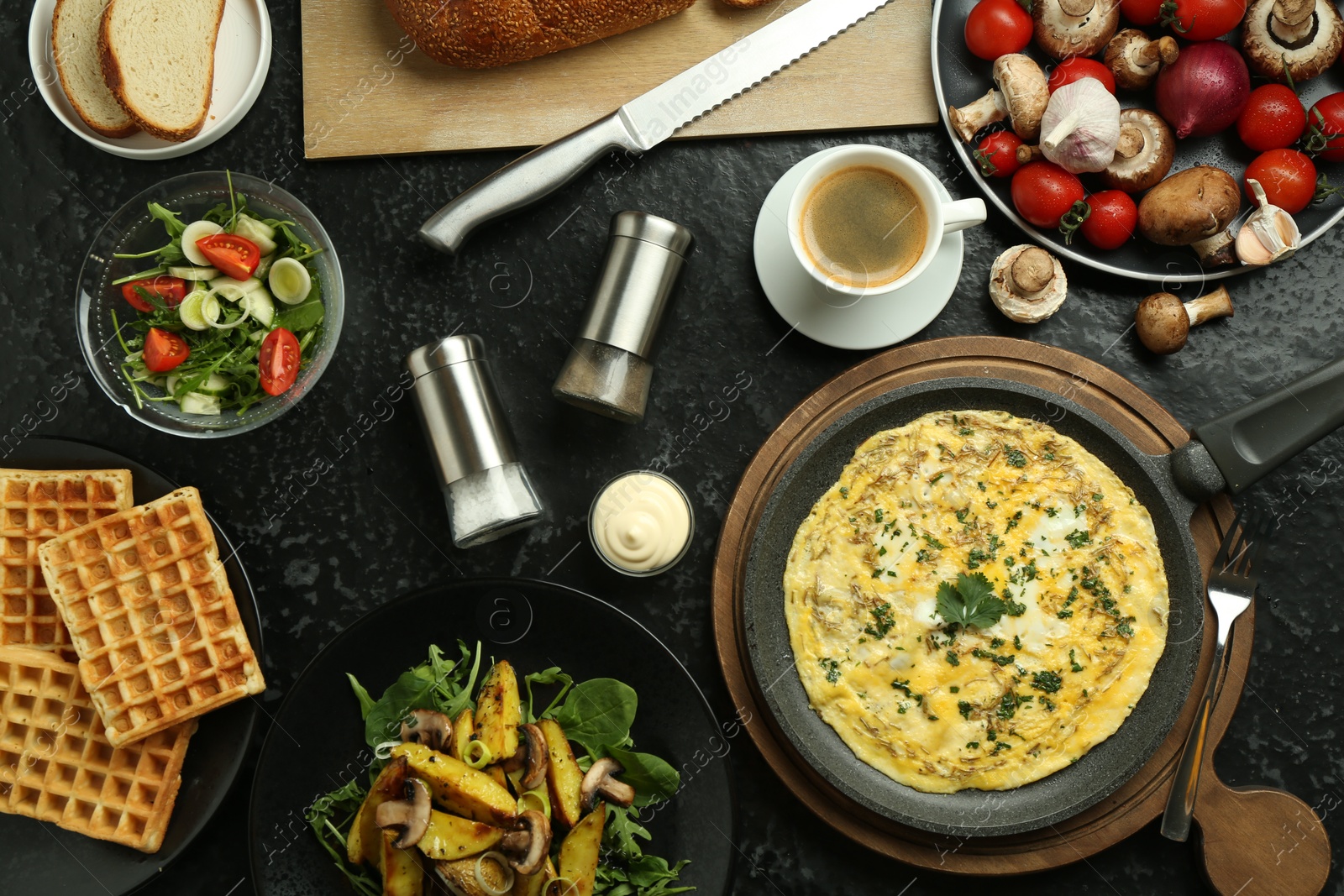 Photo of Tasty food served for brunch on black table, flat lay