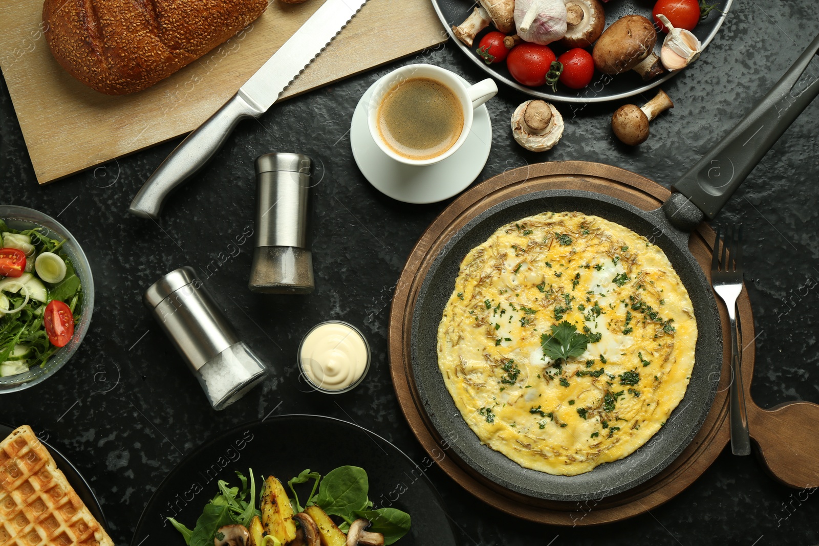 Photo of Tasty food served for brunch on black table, flat lay