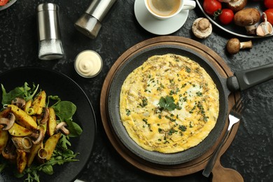 Photo of Tasty food served for brunch on black table, flat lay