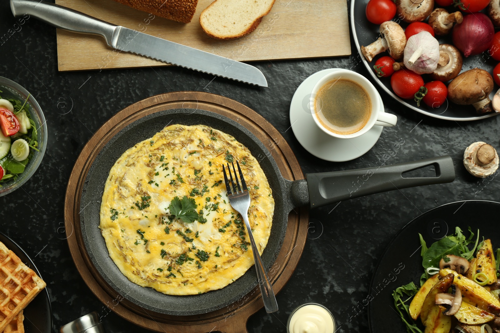 Photo of Tasty food served for brunch on black table, flat lay