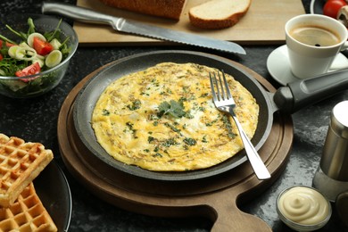 Photo of Tasty food served for brunch on black table