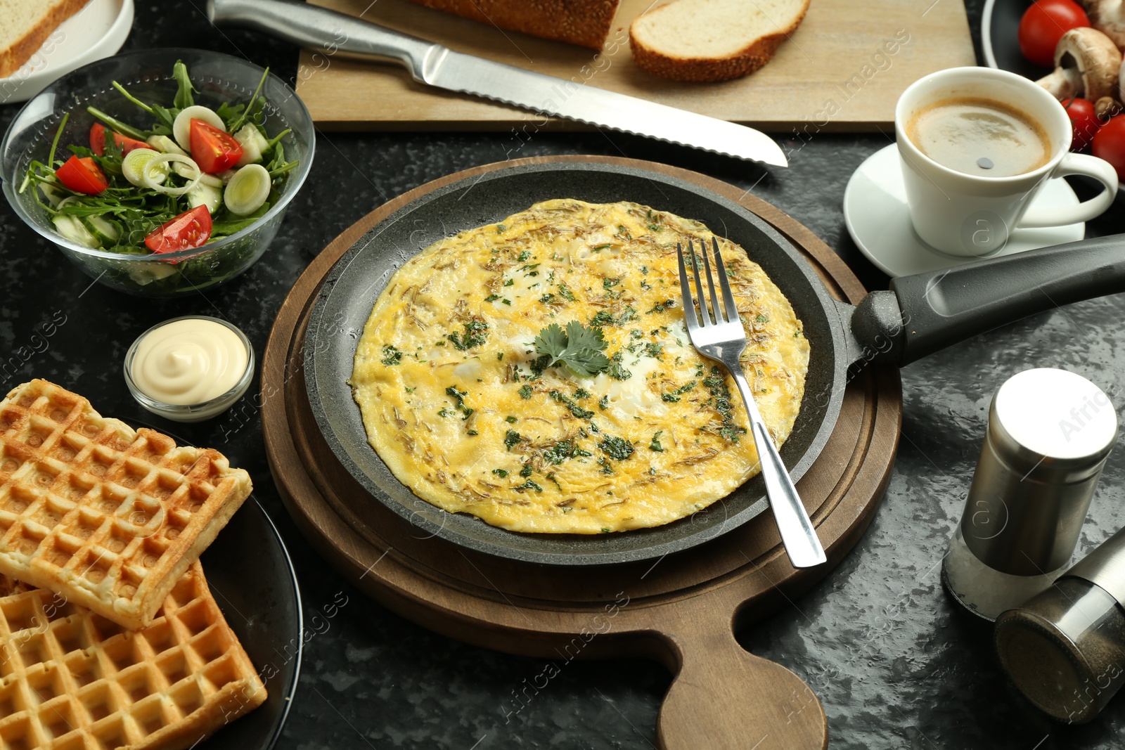 Photo of Tasty food served for brunch on black table