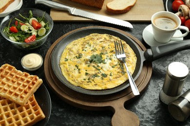 Photo of Tasty food served for brunch on black table