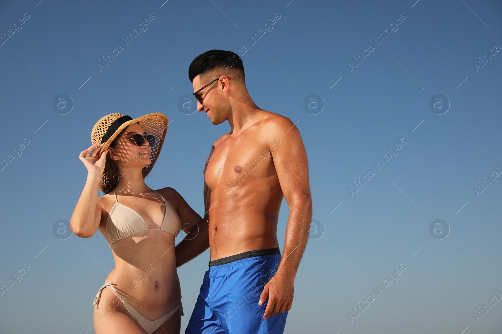 Photo of Lovely couple spending time together against blue sky