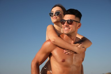 Photo of Lovely couple spending time together against blue sky