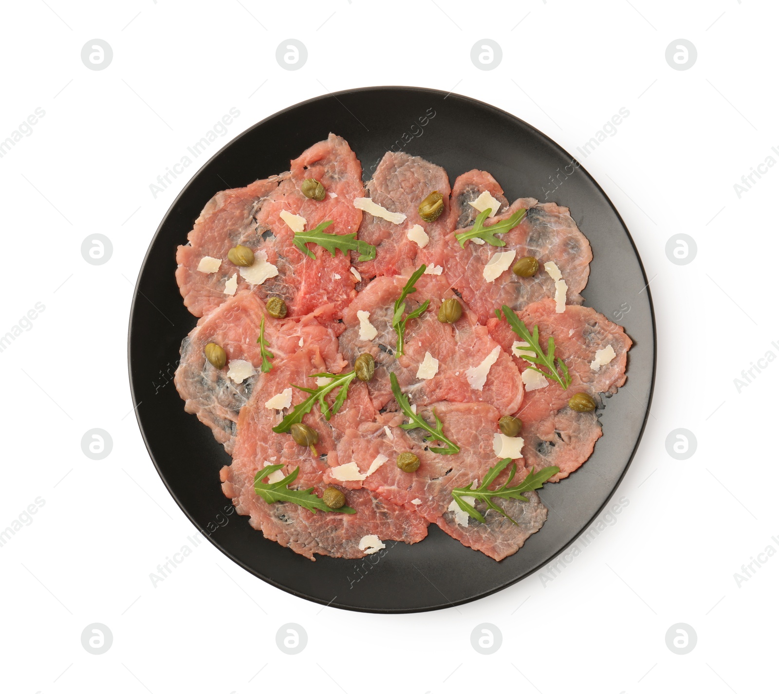 Photo of Delicious beef carpaccio with arugula, capers and cheese isolated on white, top view