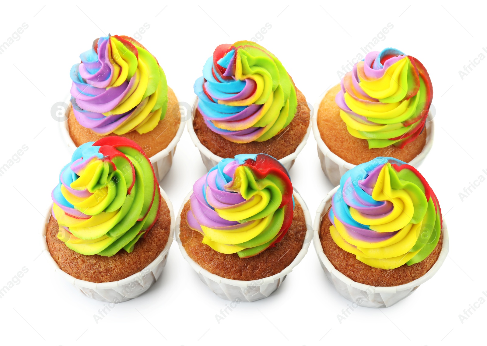 Photo of Tasty cupcakes with colorful cream isolated on white