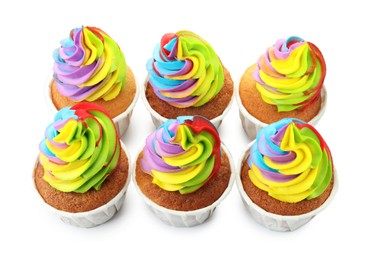 Photo of Tasty cupcakes with colorful cream isolated on white