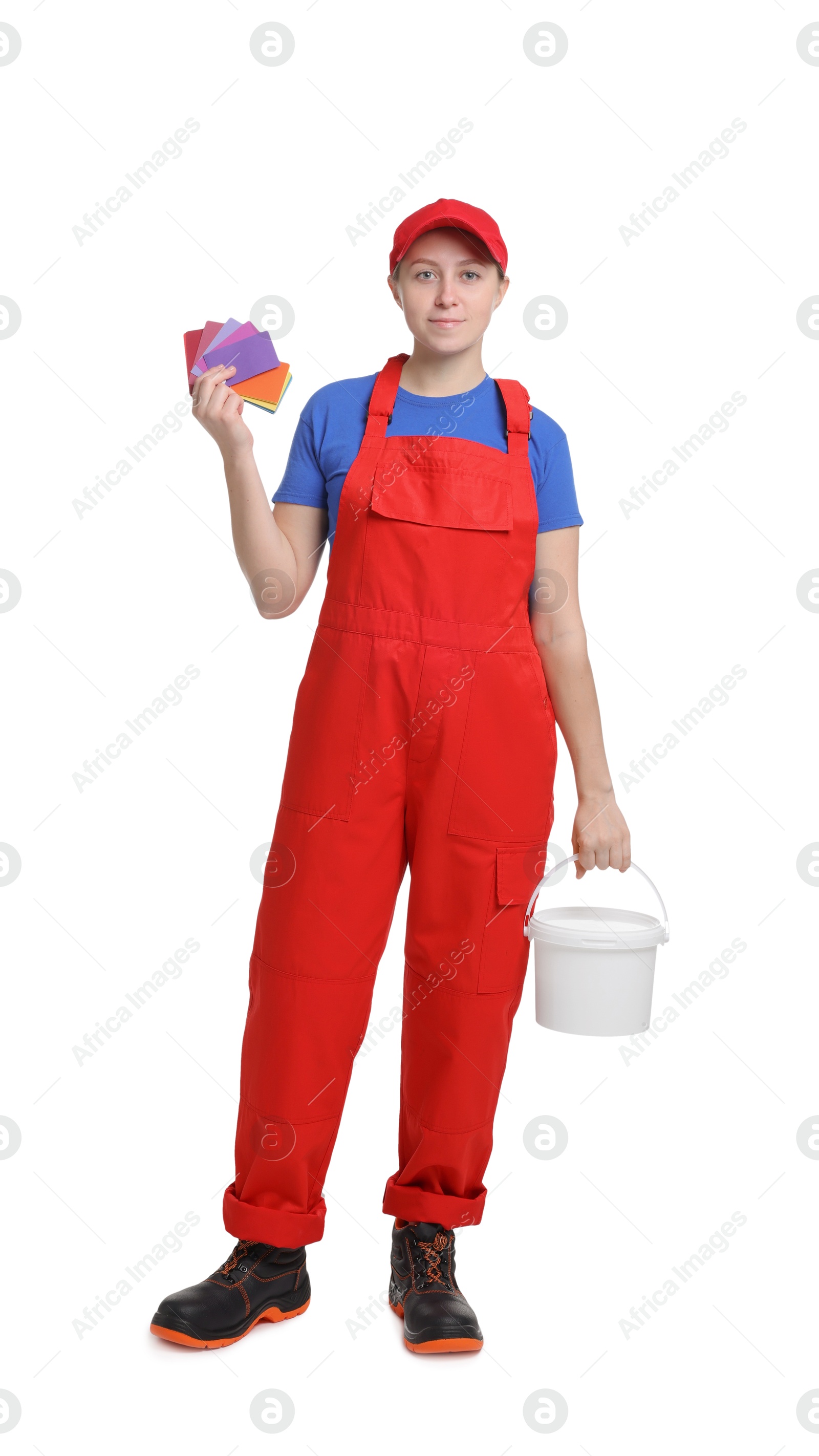 Photo of Professional painter with color samples and bucket of paint on white background