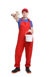 Photo of Professional painter with brush and bucket of paint on white background