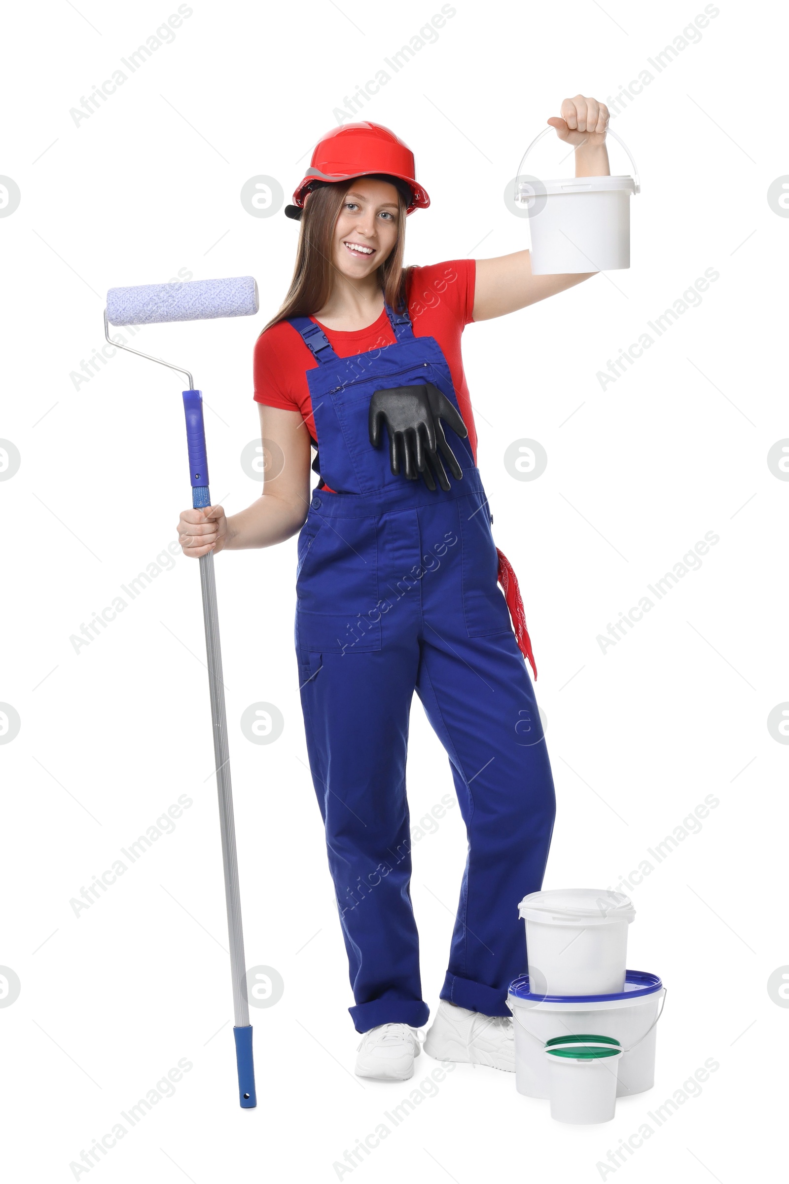 Photo of Professional painter with roller and buckets of paint on white background