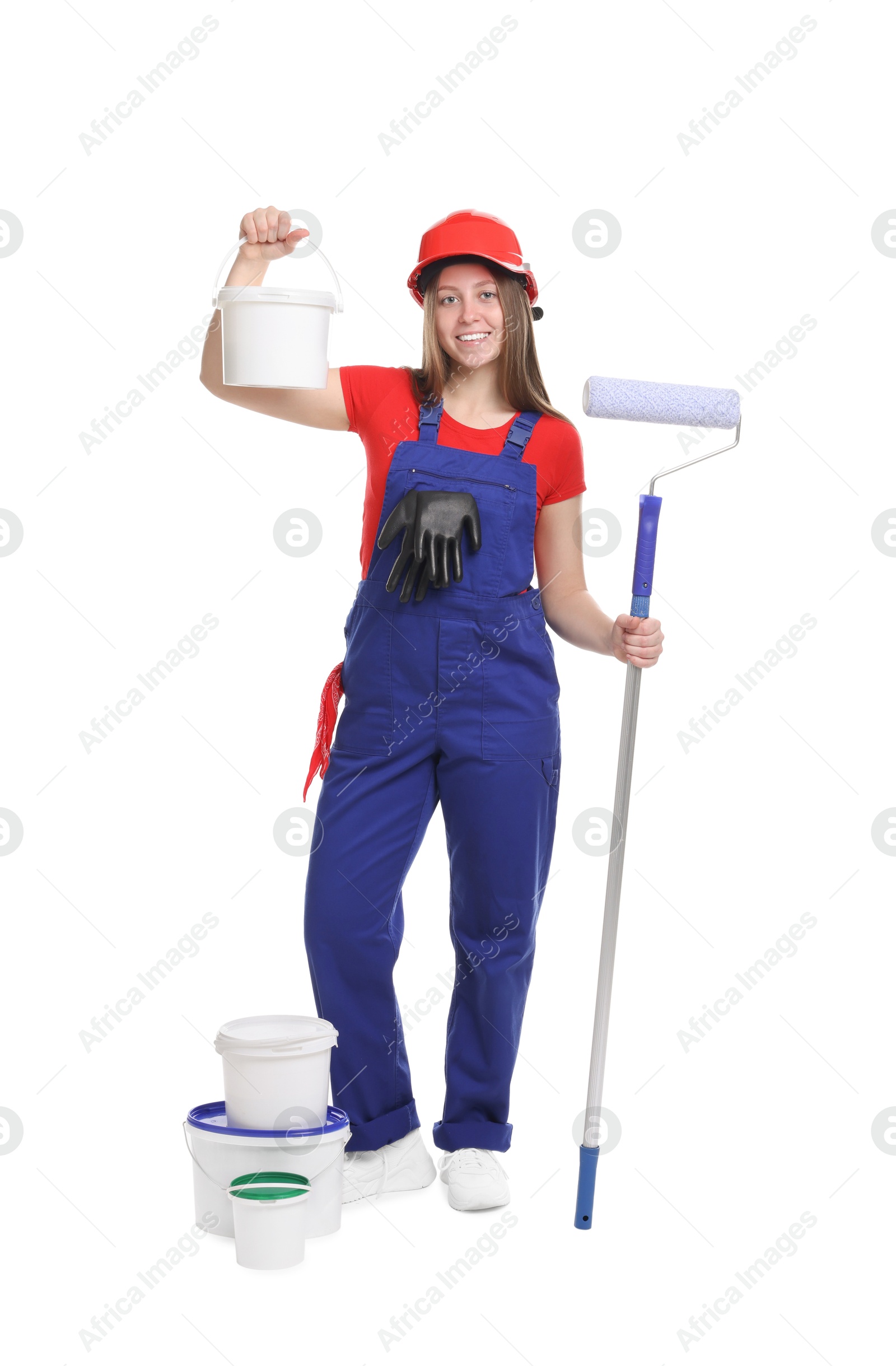 Photo of Professional painter with roller and buckets of paint on white background