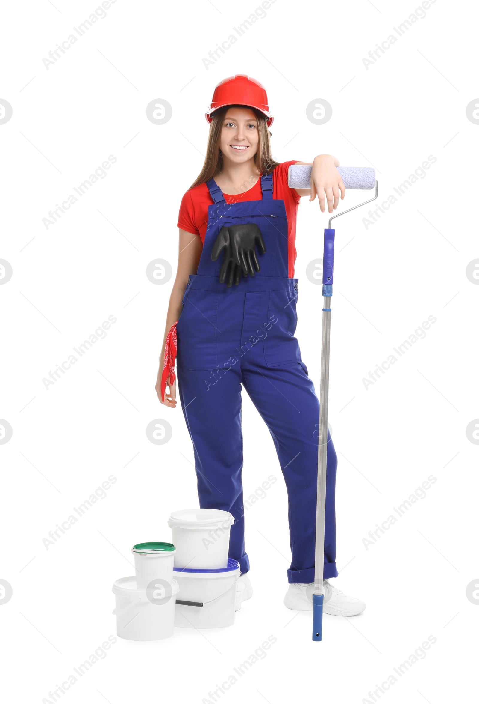 Photo of Professional painter with roller and buckets of paint on white background