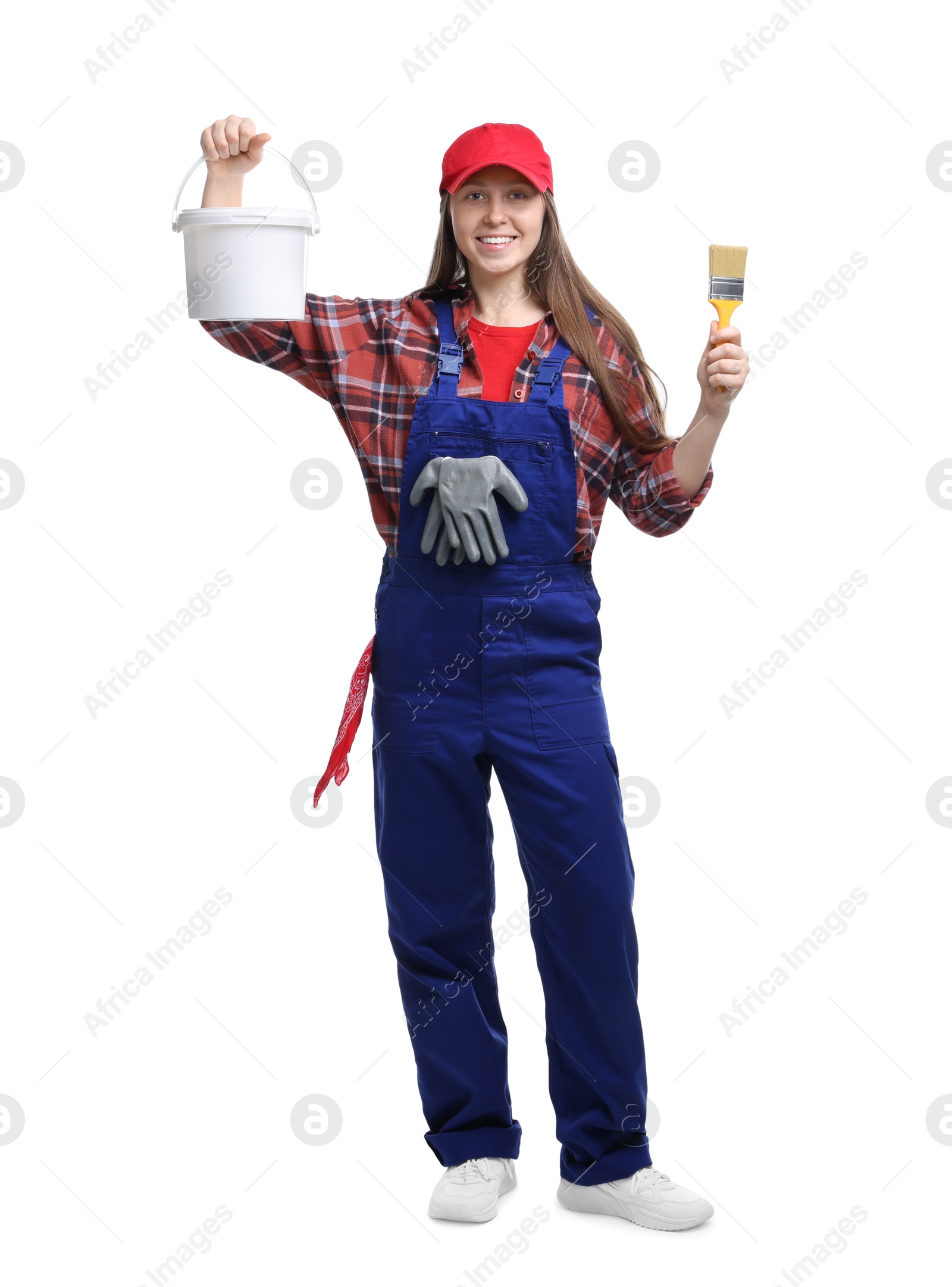 Photo of Professional painter with brush and bucket of paint on white background