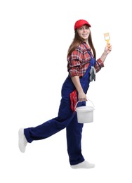 Photo of Professional painter with brush and bucket of paint on white background