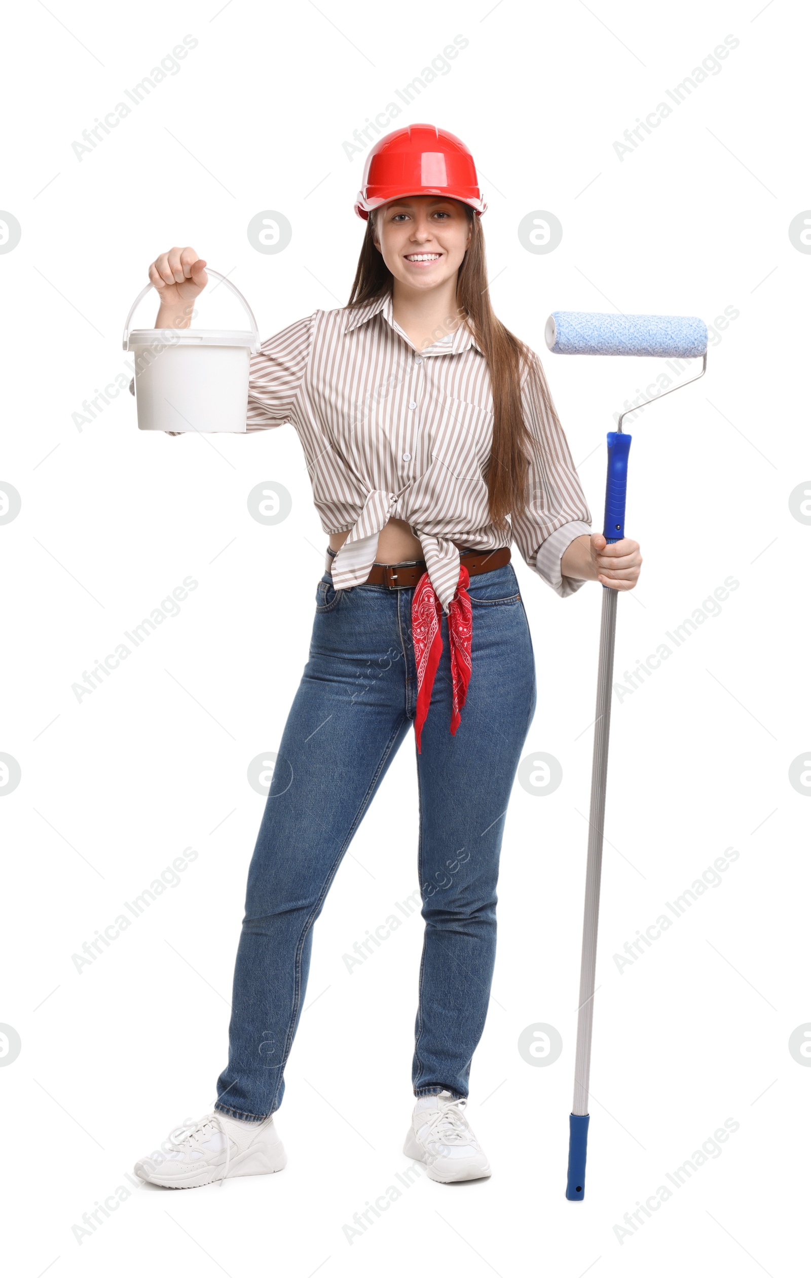 Photo of Woman wearing hardhat with roller and bucket of paint on white background