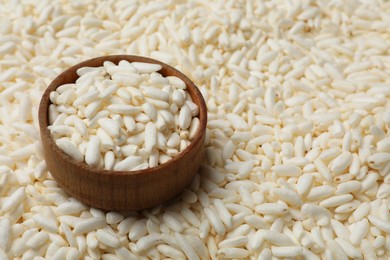 Photo of Bowl with puffed rice as background, closeup