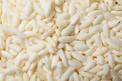 Photo of Wholegrain puffed rice as background, closeup view