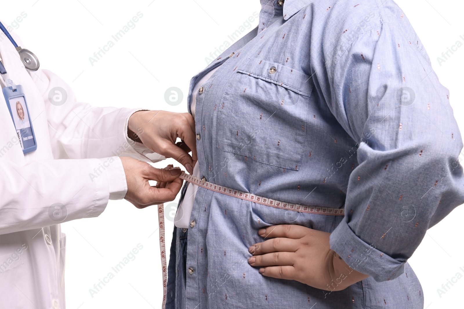 Photo of Weight loss. Nutritionist measuring patient's waist with tape on white background, closeup