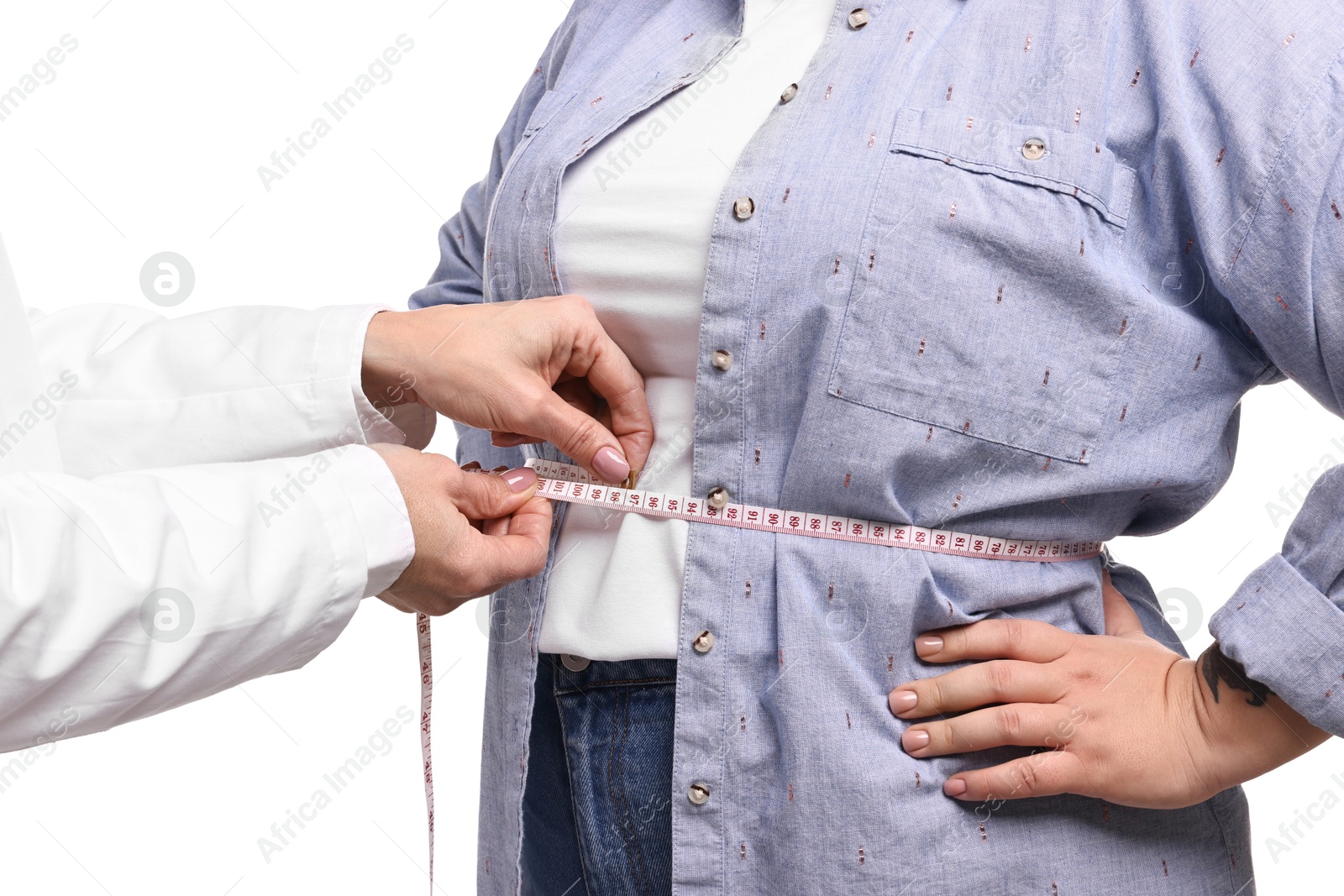 Photo of Weight loss. Nutritionist measuring patient's waist with tape on white background, closeup