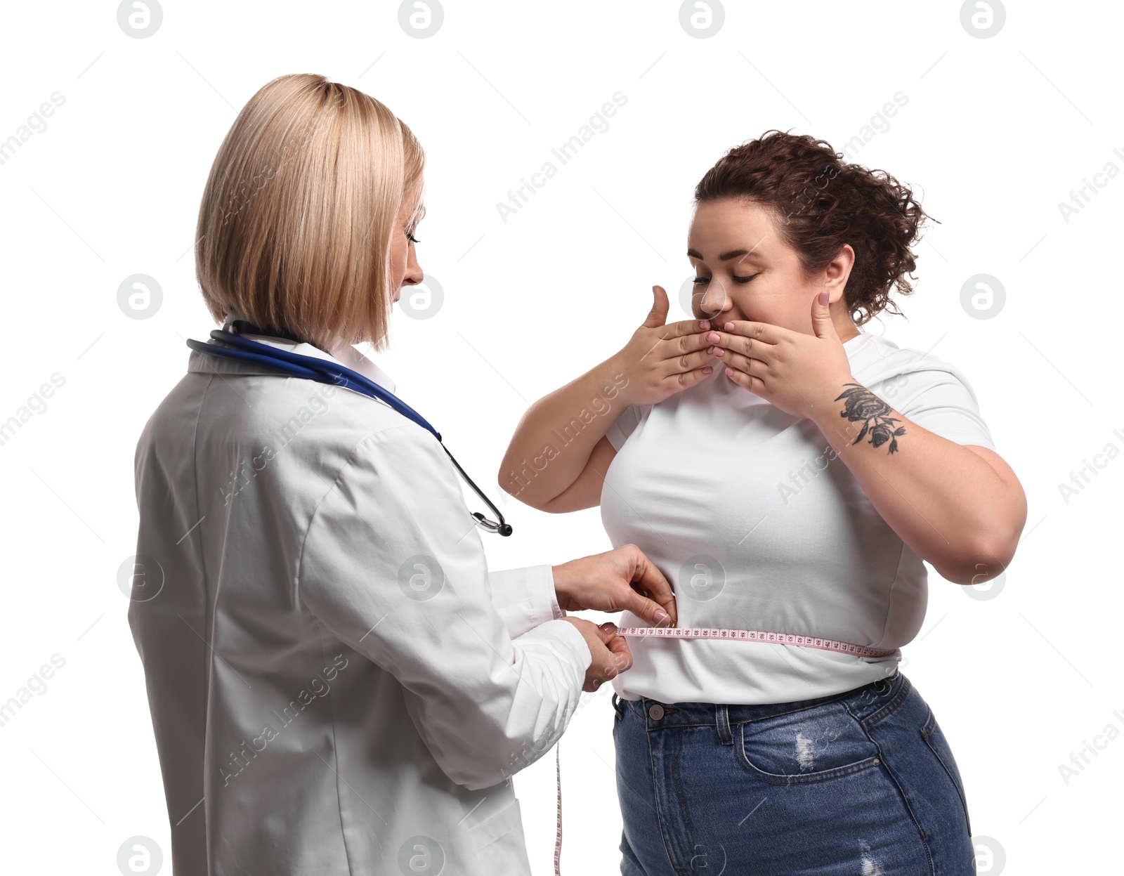 Photo of Weight loss. Nutritionist measuring patient's waist with tape on white background