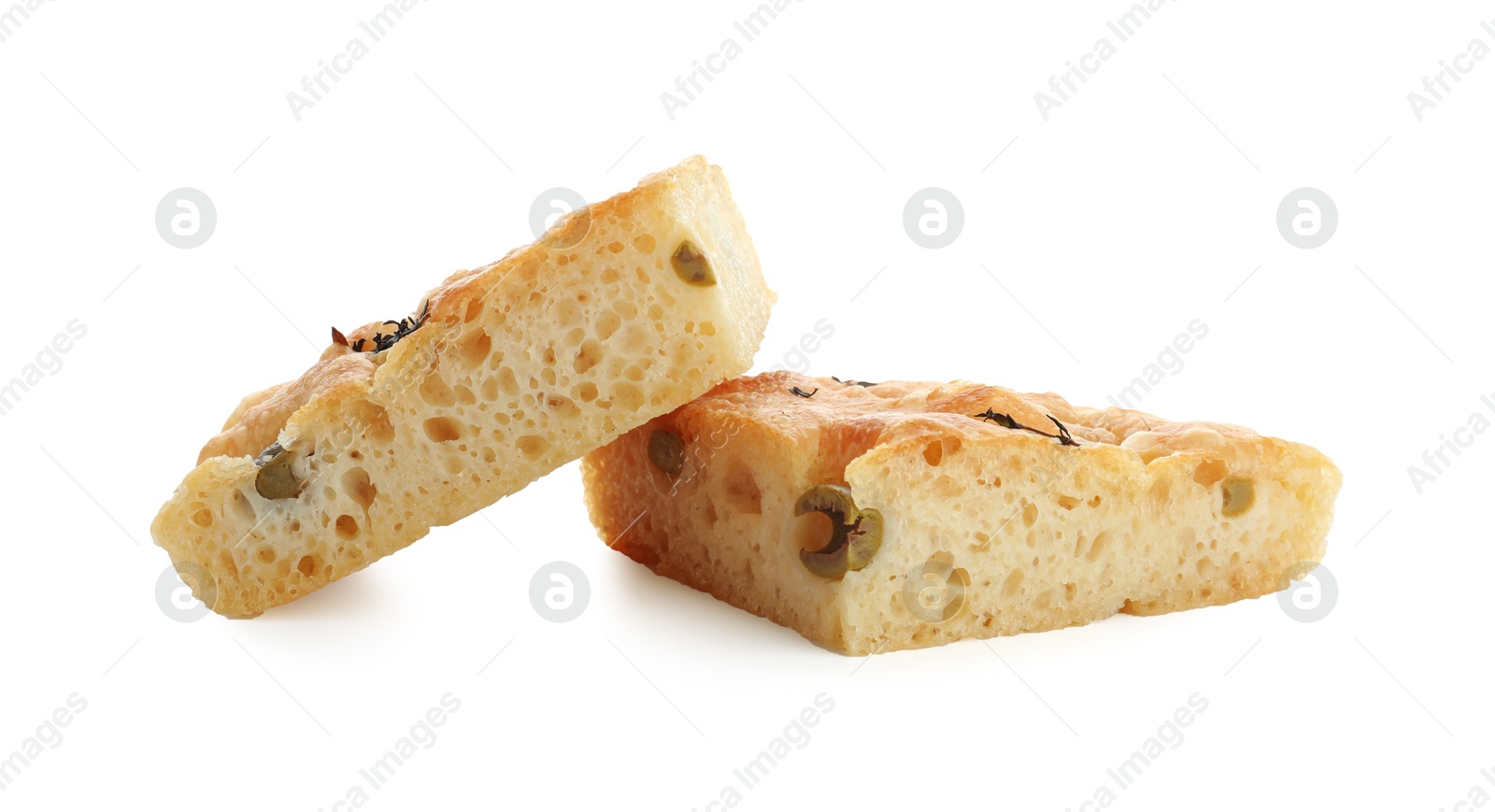 Photo of Pieces of delicious focaccia bread with olives and thyme isolated on white