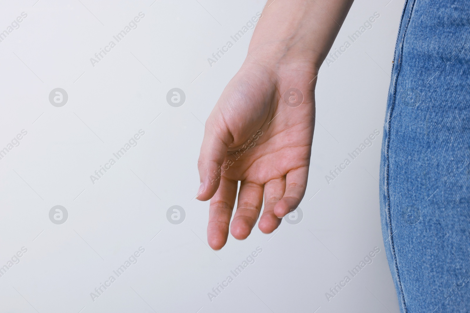 Photo of Woman with visible hand veins on white background, closeup. Space for text