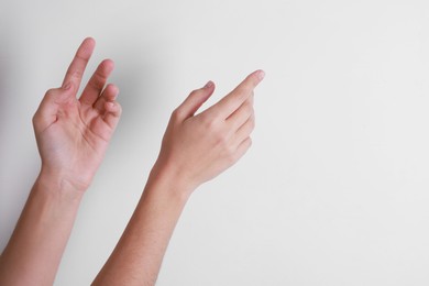 Photo of Woman with visible hand veins on white background, closeup. Space for text