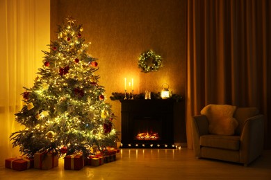 Photo of Cozy room with Christmas tree, fireplace and armchair. Interior design for holiday