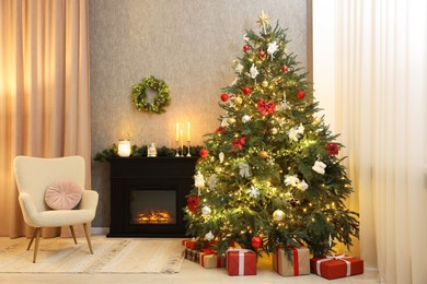 Photo of Cozy room with Christmas tree, fireplace and armchair. Interior design for holiday