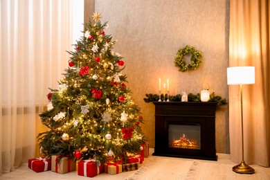 Photo of Cozy room with Christmas tree, fireplace and lamp. Festive interior design