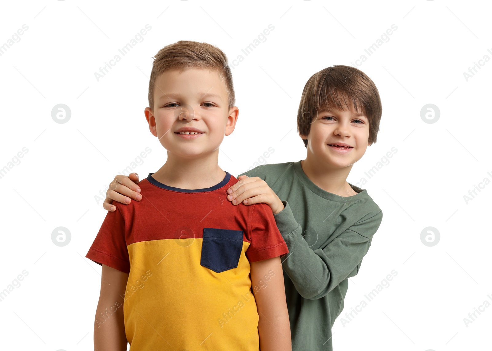 Photo of Portrait of cute brothers on white background