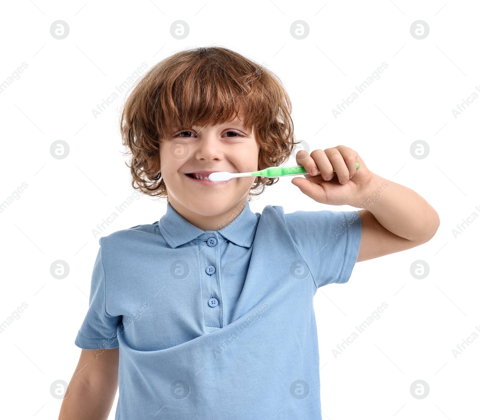 Photo of Cute boy brushing his teeth on white background