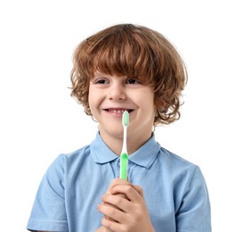 Photo of Cute boy brushing his teeth on white background