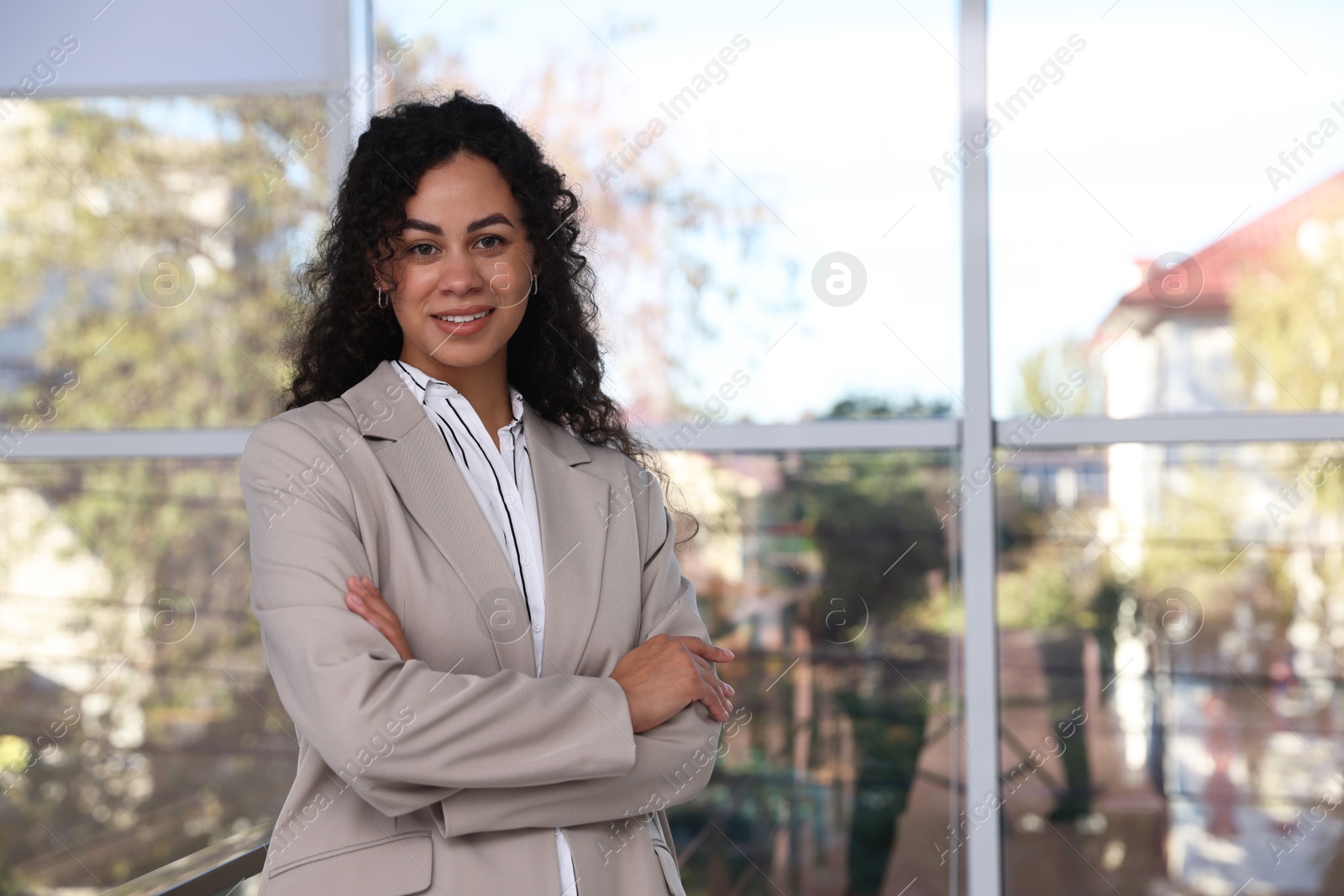 Photo of Portrait of young woman wearing stylish suit indoors. Space for text